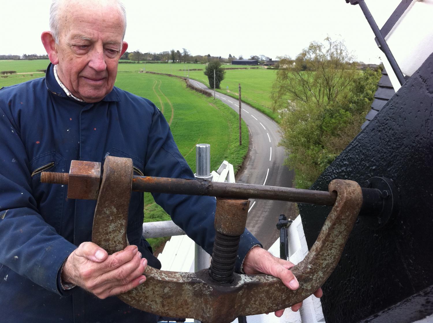 Robin Webb, (Hon Custodian) at the top of the scaffolding tower (during restoration) straightening the striking rod April 2011  - About the Trust -  Hertfordshire Building Preservation Trust